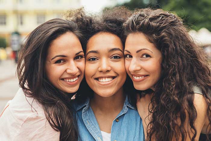 three girls smiling